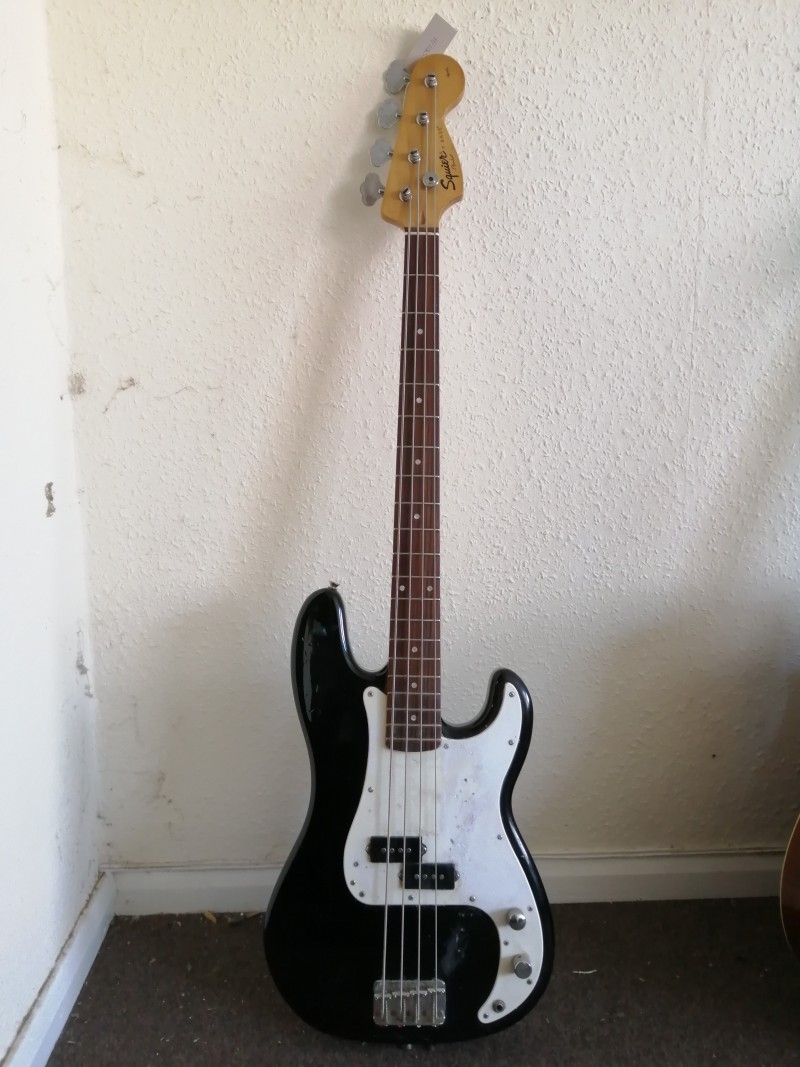 A Squier P-Bass guitar